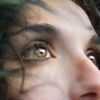 a closeup of a woman's face, focusing on her eyes