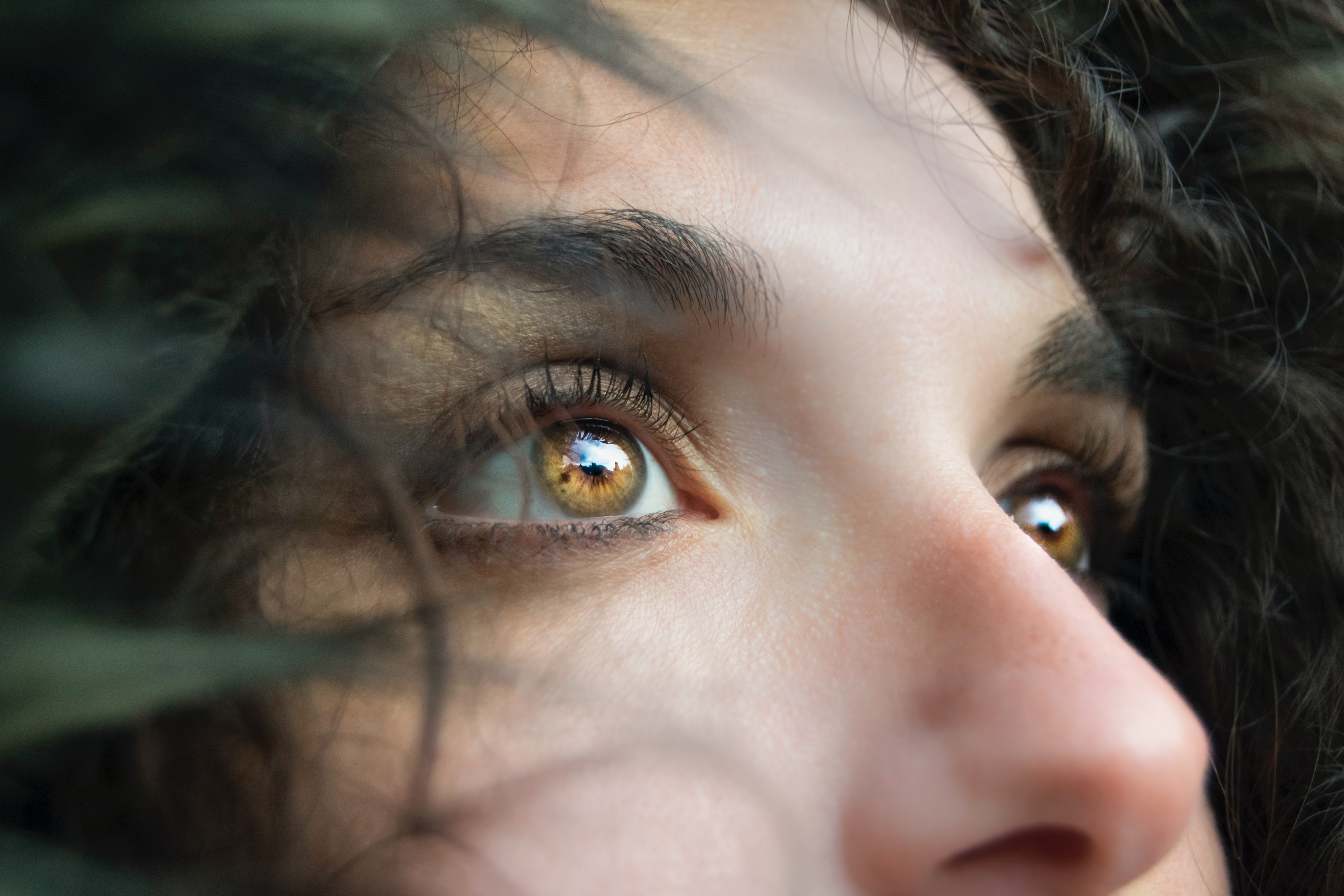 a closeup of a woman's face, focusing on her eyes