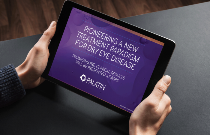 a closeup image of two hands holding a tablet with the screen showing the words 'pioneering a new treatment paradigm for dry eye disease' and the palatin logo